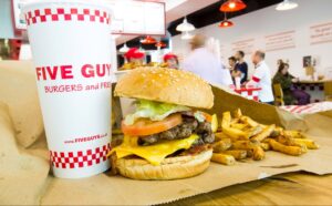 a burger and fries on a table in a restaurant