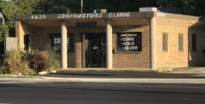 a small building with a sign on the front of it