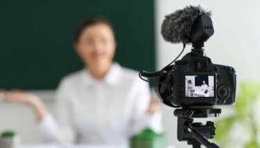 Cohort course creator streaming their content in front of a camera.