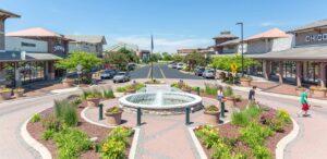 a town square with a fountain in the center