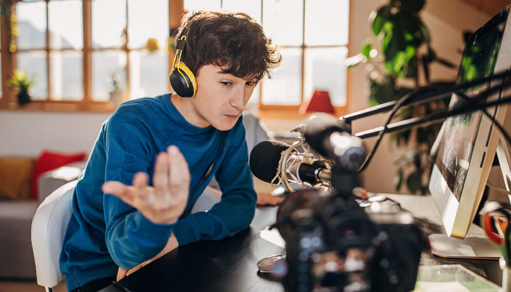 A man talks to a camera while live streaming.