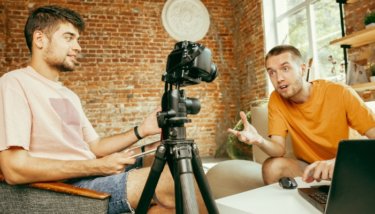 An image showing two men talking about ways of making money with live streaming.