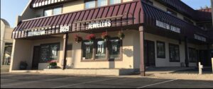 a building with a red awning on the top of it