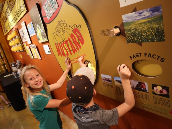 Young girl and boy playing game at National Mustard Museum