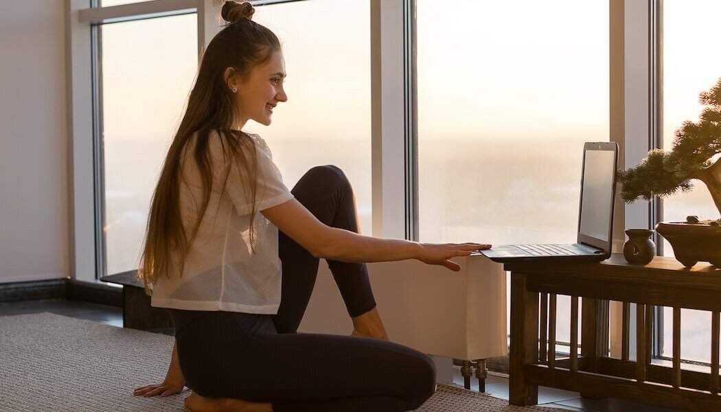 Woman discussing with her clients through her online coaching platform.