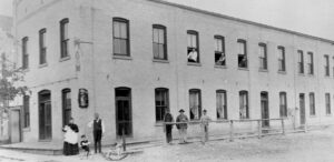 a group of people standing outside of a building