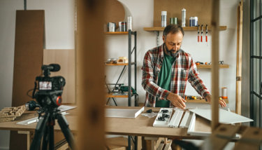 A man is creating an instructional video to upload to a Teachable alternative platform.