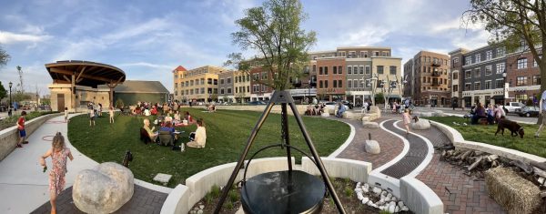 A 360 degree view of a park with people walking around.